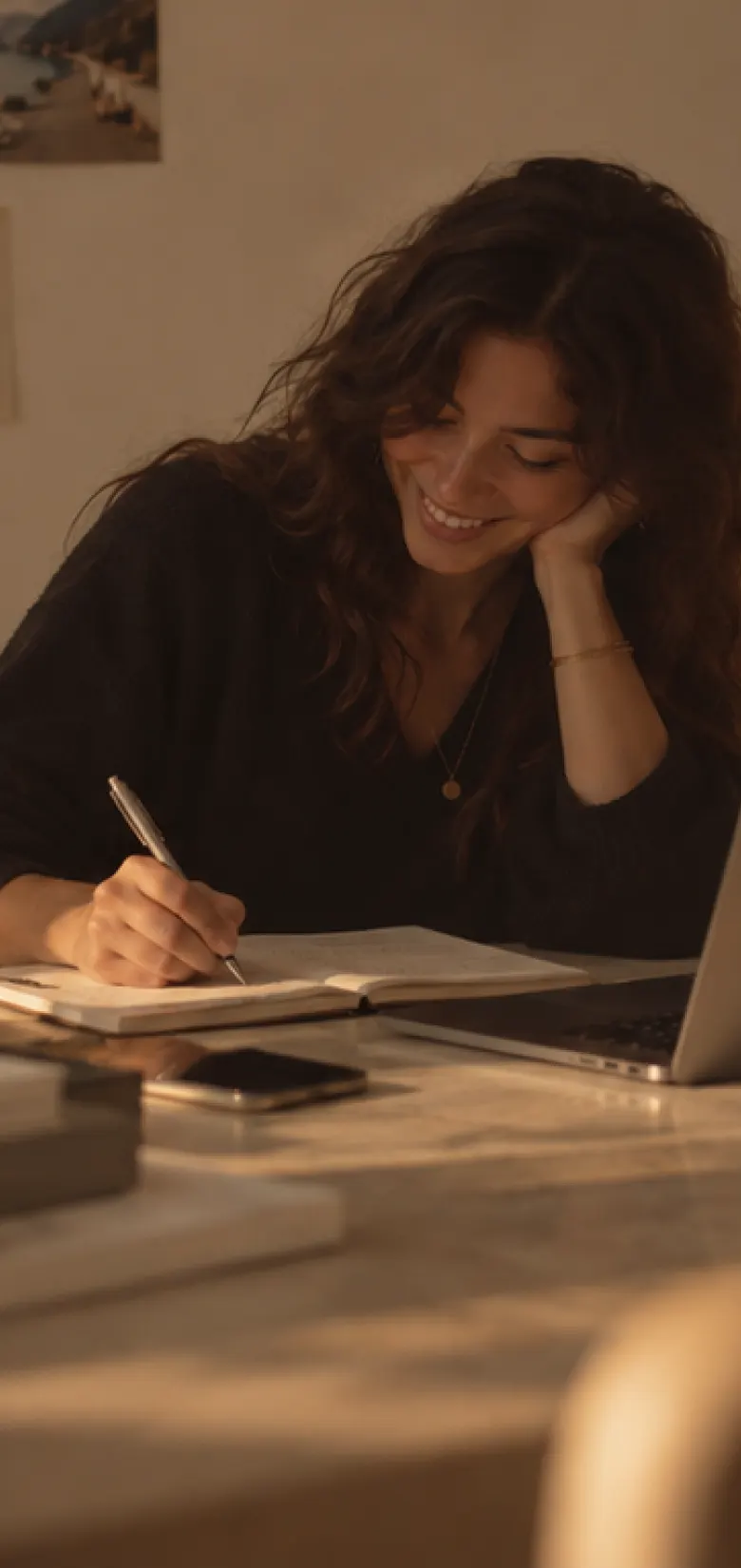 A personal assistant smiling while she works at her desk